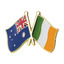 A badge featuring the flags of Australia and Ireland crossed over a butterfly clutch, with a brass plated iron and hard enamel finish. © Tigoli® 2026 All Rights Reserved Panda Loco Ltd