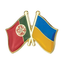 A friendship pin badge featuring the flags of Portugal and Ukraine with a butterfly clutch, primarily in gold, red, green, and blue colors. © Tigoli® 2026 All Rights Reserved Panda Loco Ltd