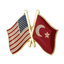 A friendship pin badge featuring the American flag and the Turkish flag on a red background with a butterfly clutch. © Tigoli® 2026 All Rights Reserved Panda Loco Ltd