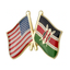 A pin badge featuring crossed American and Kenyan flags.