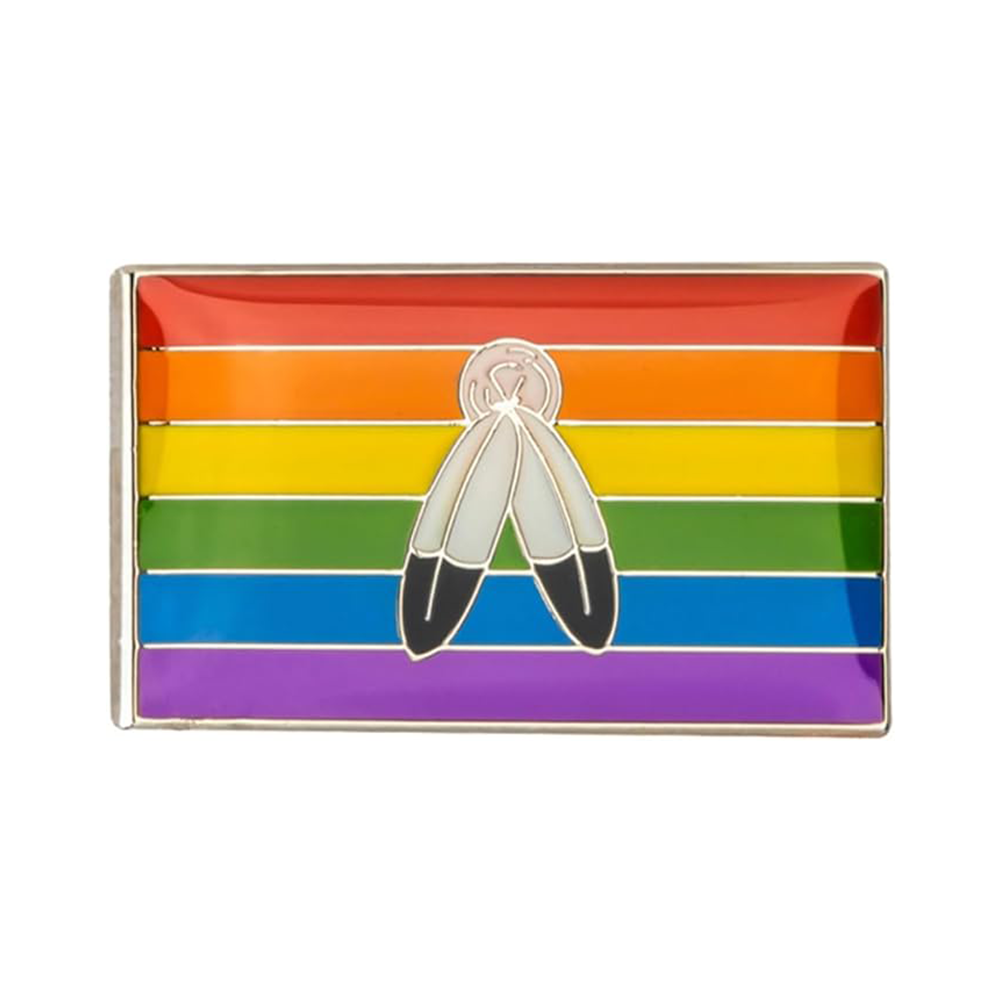 A rectangular enamel pin badge featuring a colorful flag pattern with a Two Spirit character and a butterfly clutch at the back. Imagen principal del producto