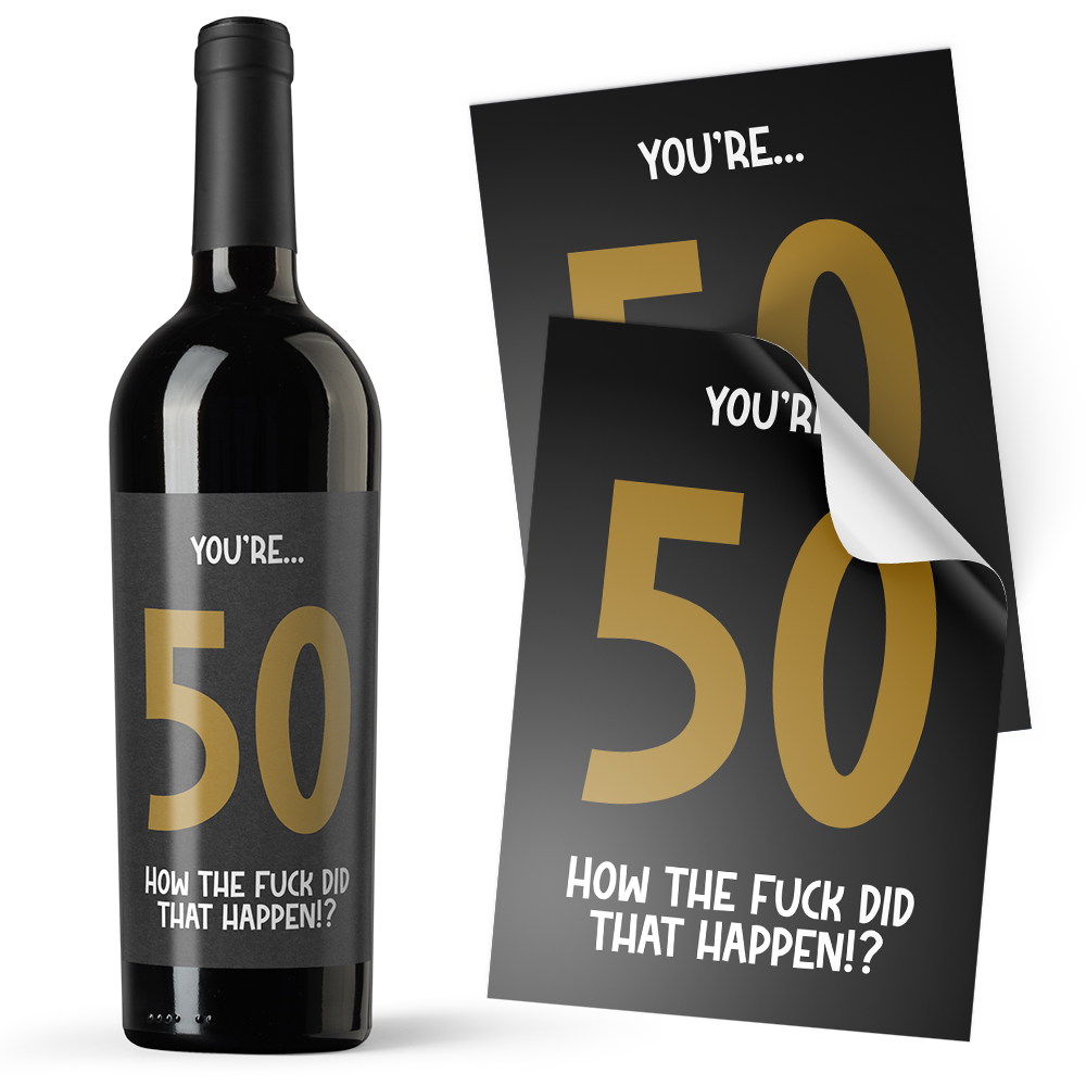 A black sticker with gold text on it, designed to be applied to an alcohol bottle, with the text 'YOU'RE.