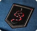 Coral Snake On Black Shield Iron On Patch (9 x 7.6cm)