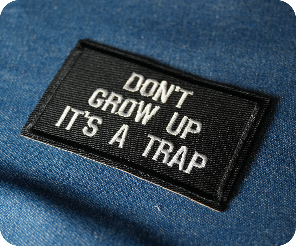 Don't Grow Up It's A Trap Black Iron On Patch (7.8 x 5cm)