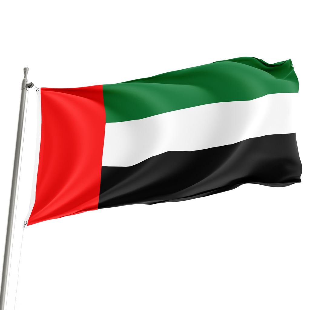The flag of the United Arab Emirates, featuring horizontal stripes in red, white, and black colors, is displayed on a flagpole.