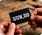 Gun Do. Black Iron On Patch (7.8 x 5cm)