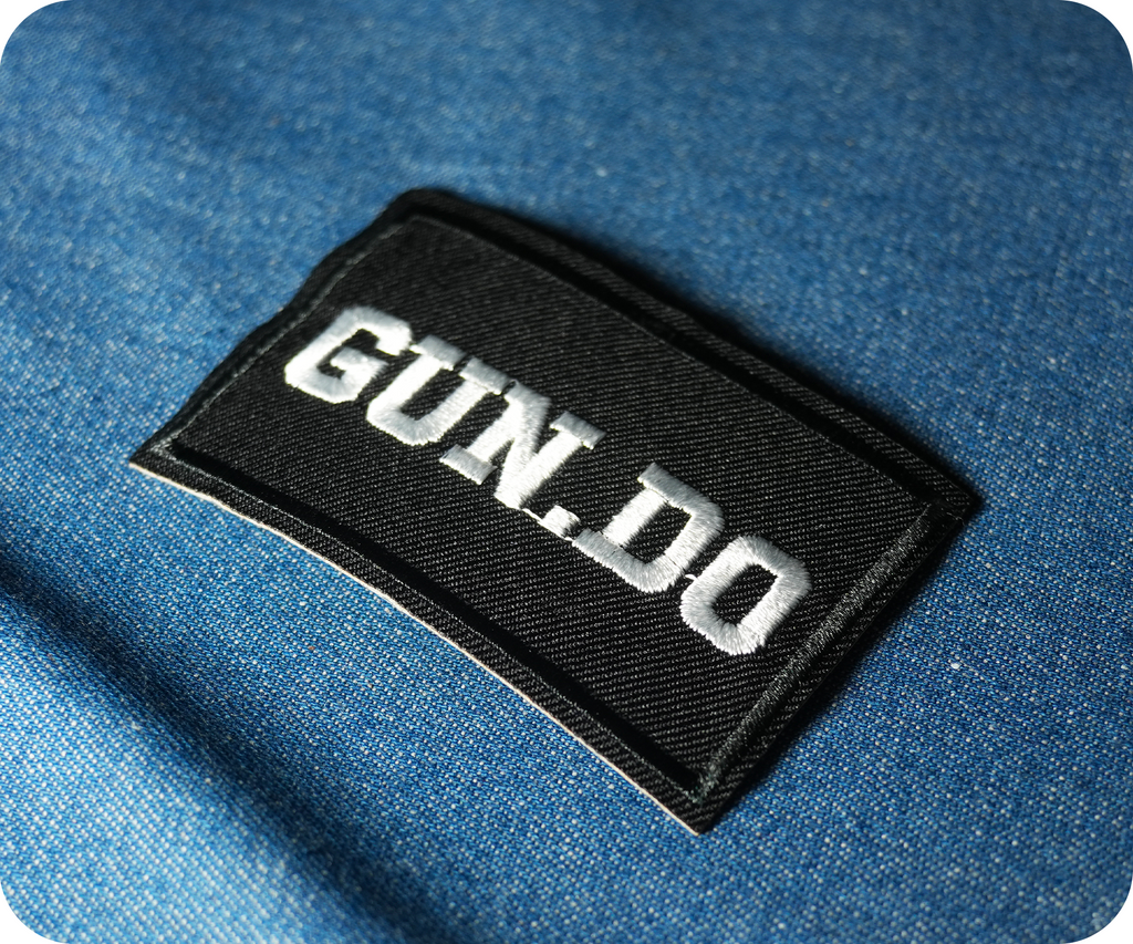 Gun Do. Black Iron On Patch (7.8 x 5cm)