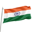 The flag of India, featuring horizontal stripes in orange, white, and green colors with a navy blue wheel in the center, is flying on a flagpole.