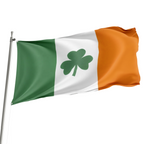 A flag with horizontal stripes in green and orange colors, featuring a large white shamrock in the center, flying from a pole.