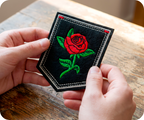 Red Rose Large On Stem & Black Shield Iron On Patch (9 x 7.6cm)