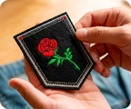 Red Rose Small On Stem & Black Shield Iron On Patch (9 x 7.6cm)