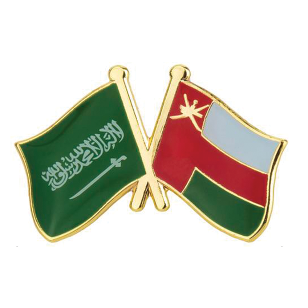 A friendship pin badge featuring enamel with Saudi Arabian and Omani flags in green, red, and blue on a gold-plated background with a butterfly clutch. © Tigoli® 2026 All Rights Reserved Panda Loco Ltd 