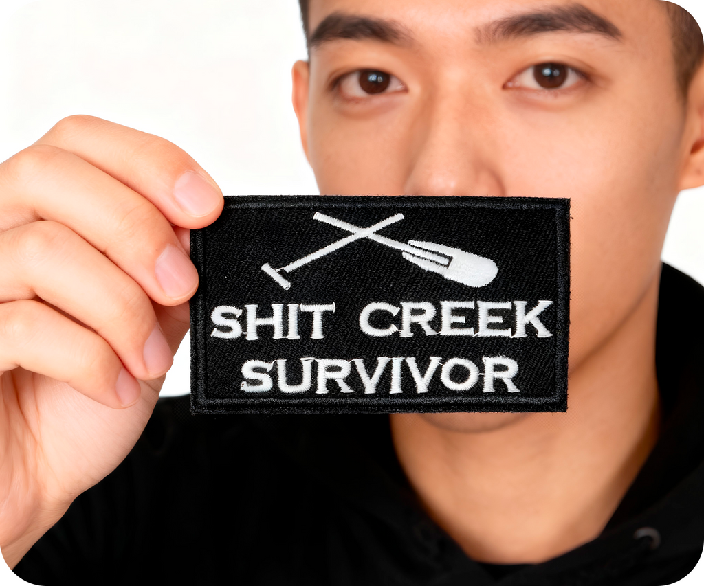 Shit Creeks Survivor Black Iron On Patch (7.8 x 5cm)