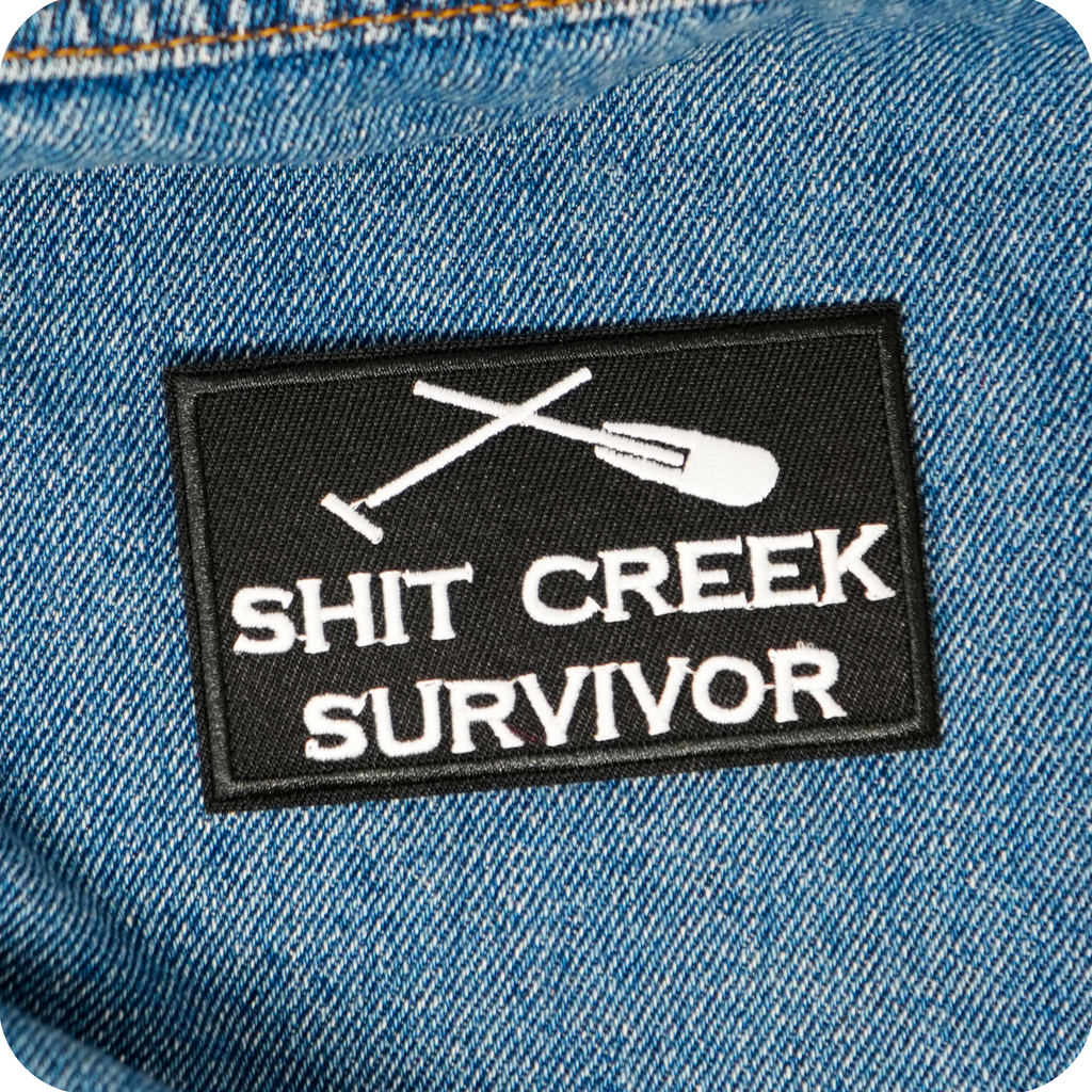 Shit Creeks Survivor Black Iron On Patch (7.8 x 5cm)