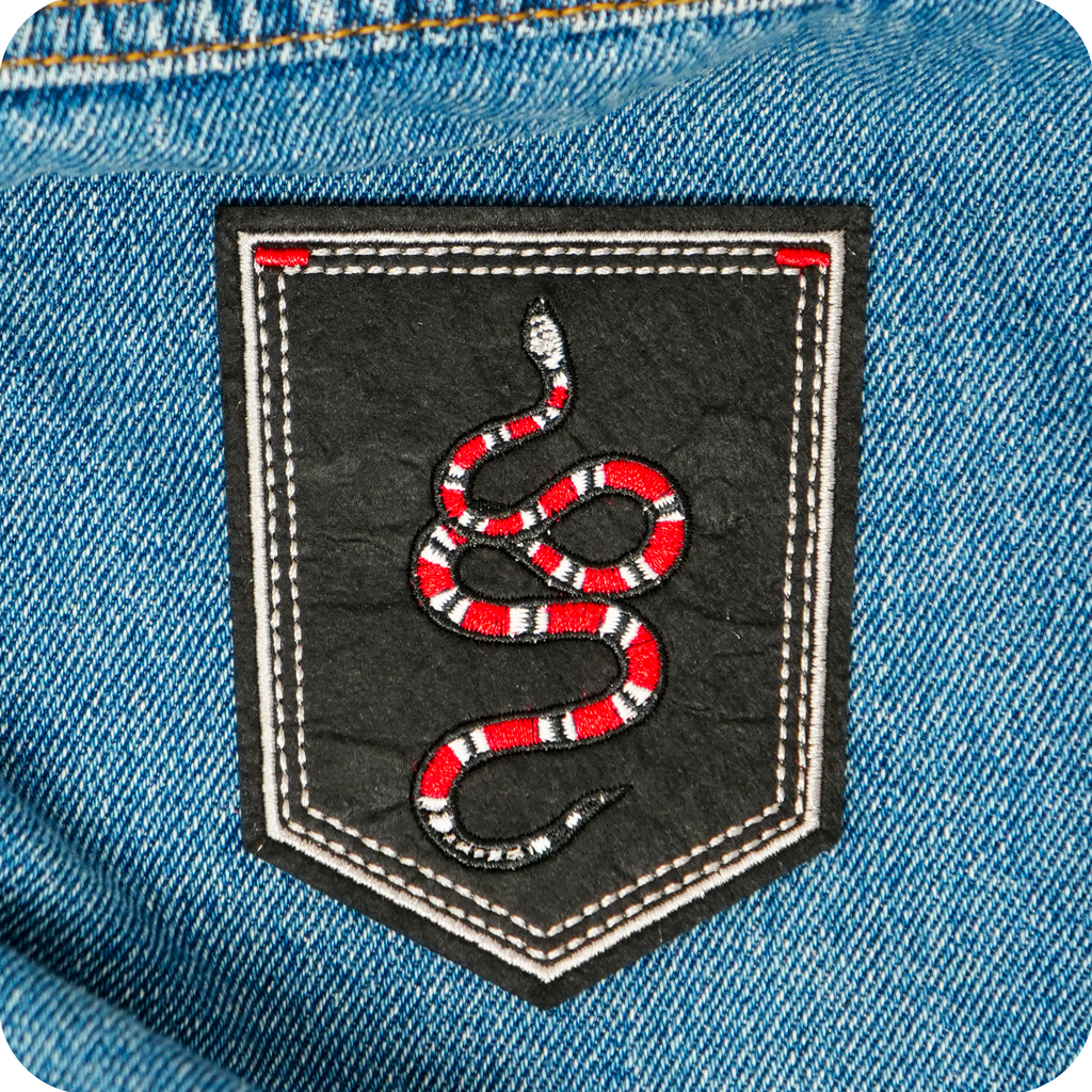 Coral Snake On Black Shield Iron On Patch (9 x 7.6cm)