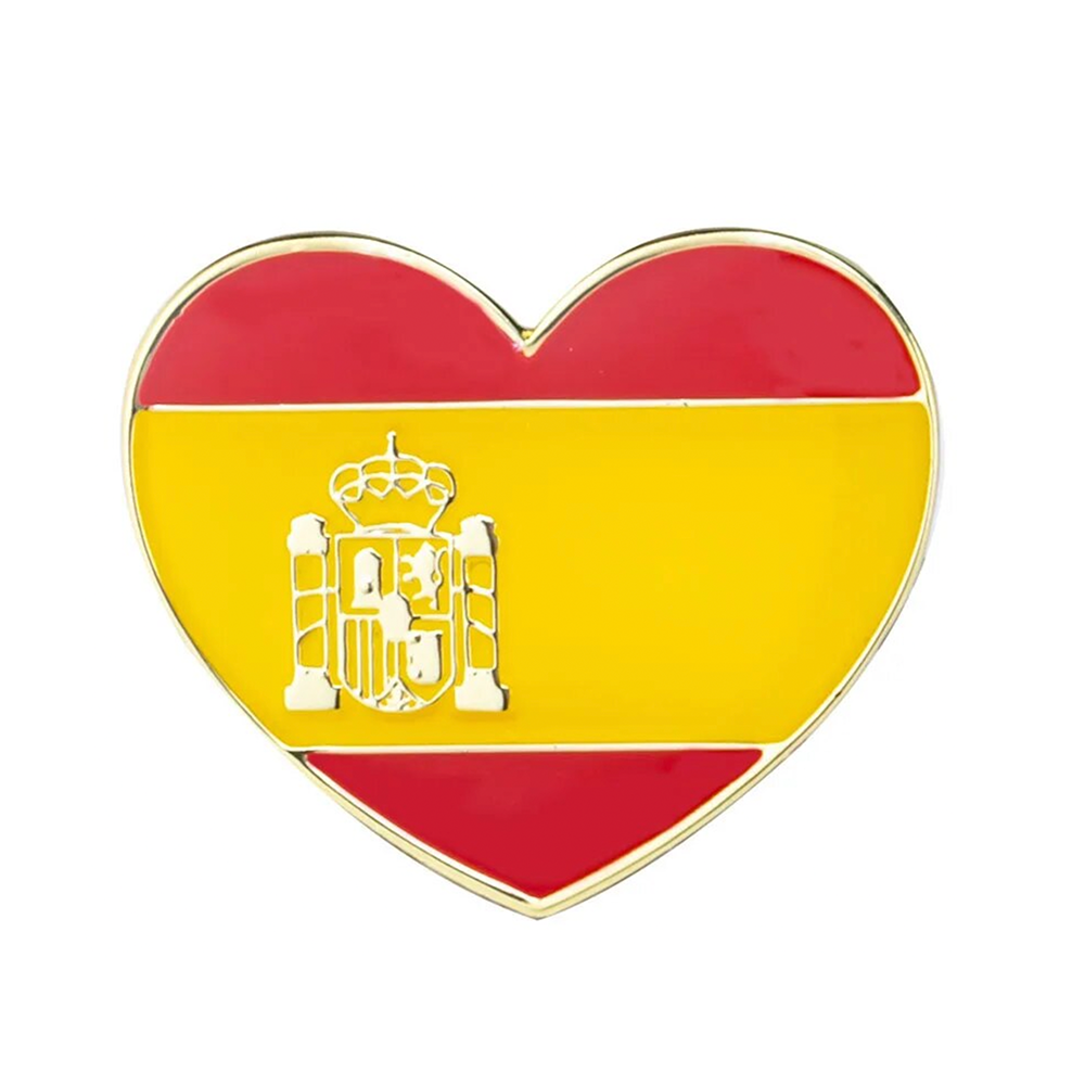 A heart-shaped pin badge with the Spanish flag colors and a crown emblem in the center, designed in yellow and red, with a metallic finish.