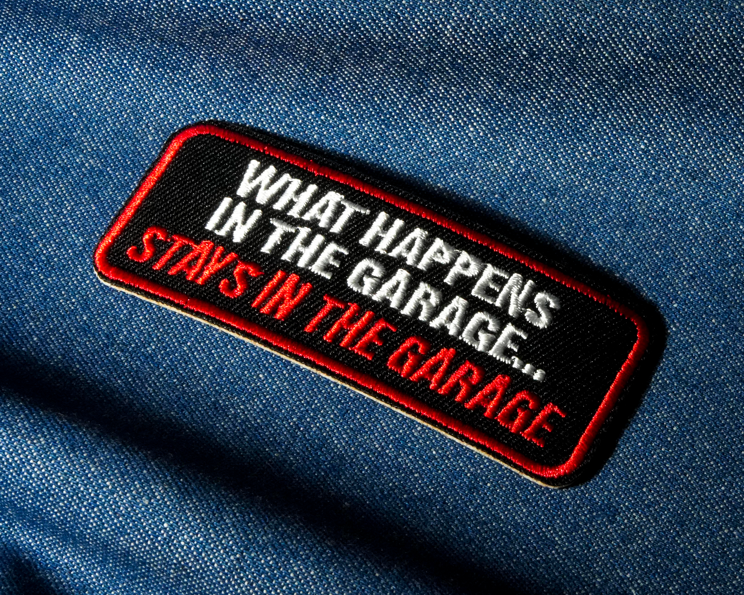 What Happens In The Garage Stays In The Garage Patch Iron On (9 x 3.5cm) Secondary image