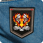 Tiger Face On Black Shield Iron On Patch (9 x 7.6cm)