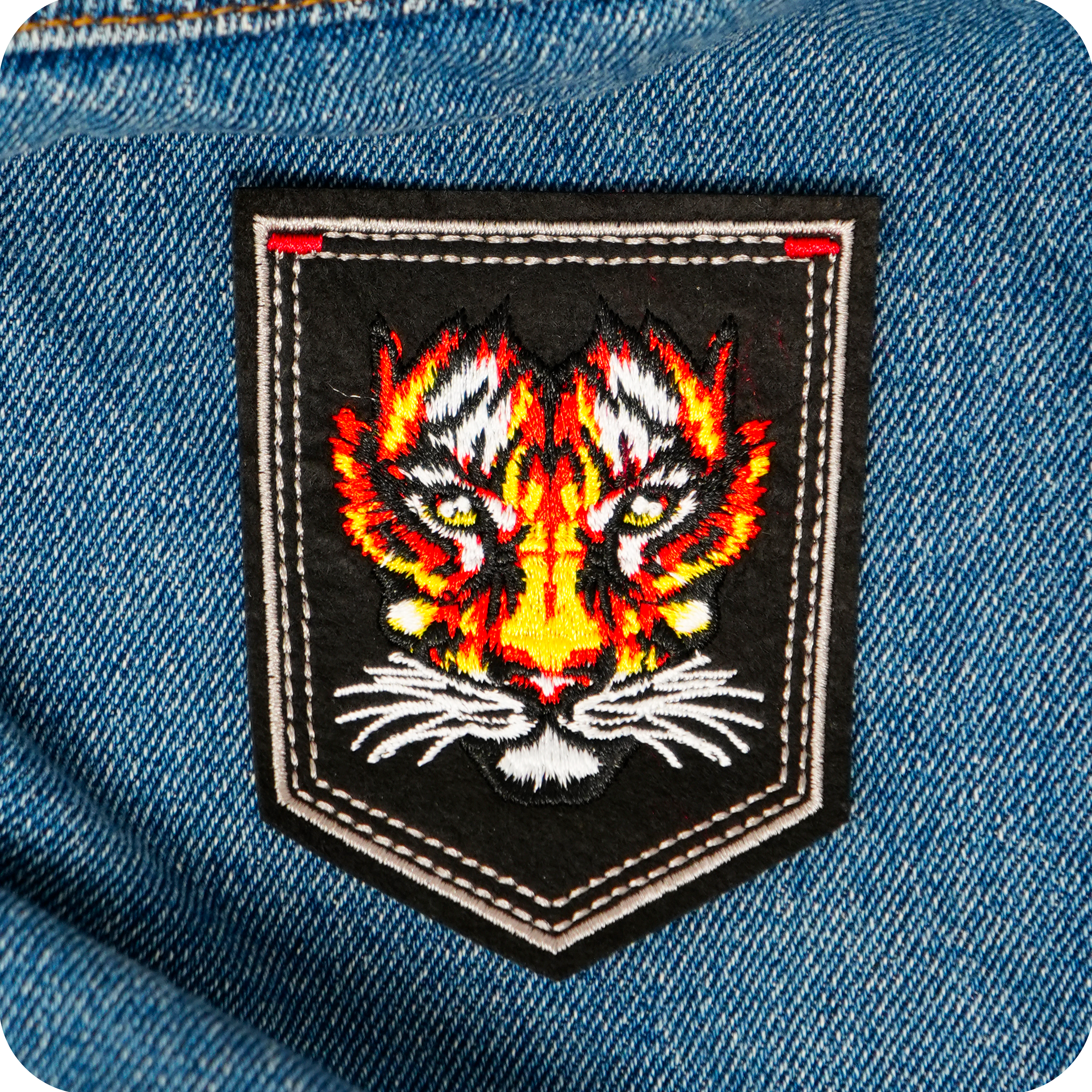 Tiger Face On Black Shield Iron On Patch (9 x 7.6cm)