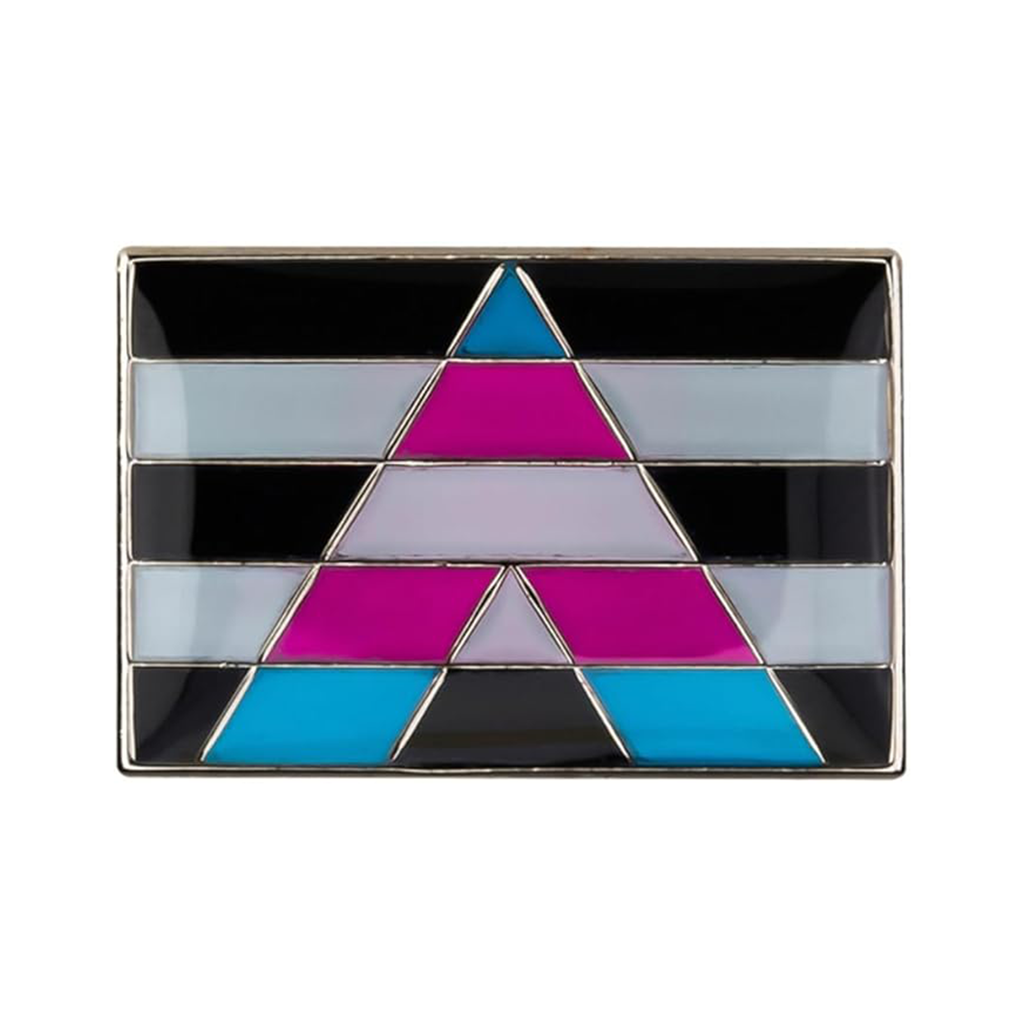 A rectangular pin badge featuring a geometric pattern with transgender flag colors: pink, blue, black, and teal, on a silver-colored background.
