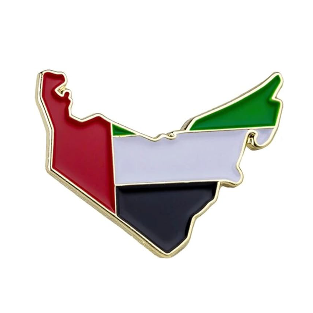 A pin badge in the shape of the United Arab Emirates with a red, white, and black color scheme and a gold-colored edge.