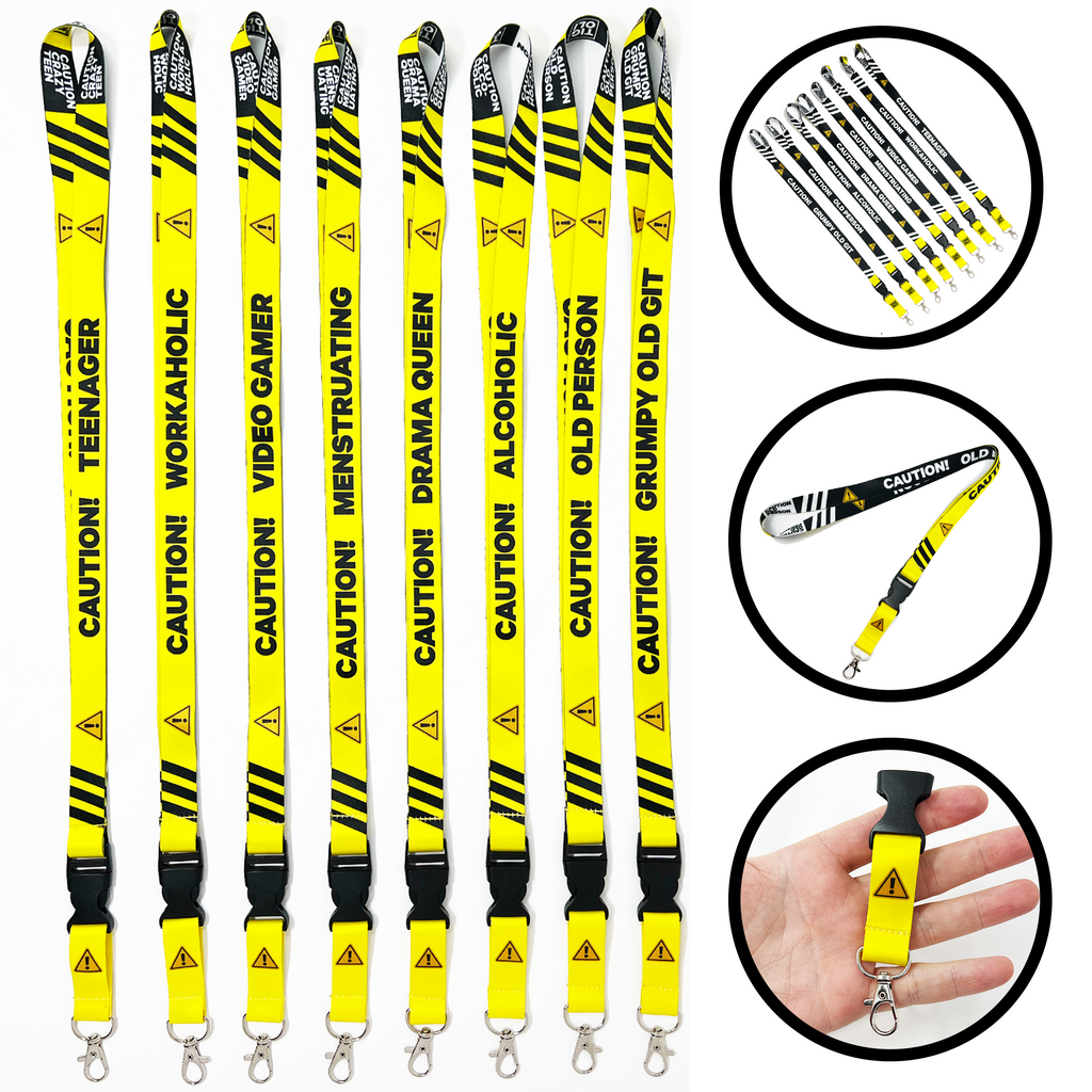 A collection of yellow and black lanyards with various humorous text designs, including 'Caution! Insanely Funny Lanyard' and 'Video Gaming Queen'. One lanyard features a detachable buckle.