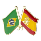 A metallic pin badge featuring the flags of Brazil and Spain with a butterfly clutch, designed in gold, green, red, and yellow colors.