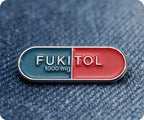 Fukitol Pin Badge