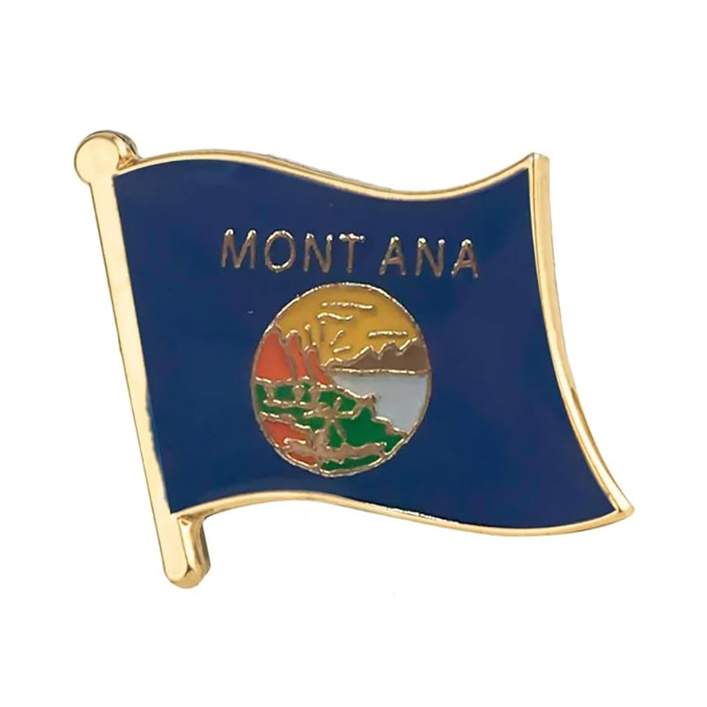 A brass plated iron pin badge featuring the flag of Montana with the state's name 'MONTANA' at the top and a graphic of mountains and a sunset in the state emblem.