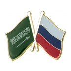 A pin badge featuring the flags of Saudi Arabia and Russia with a gold-plated edge and a butterfly clutch at the back.