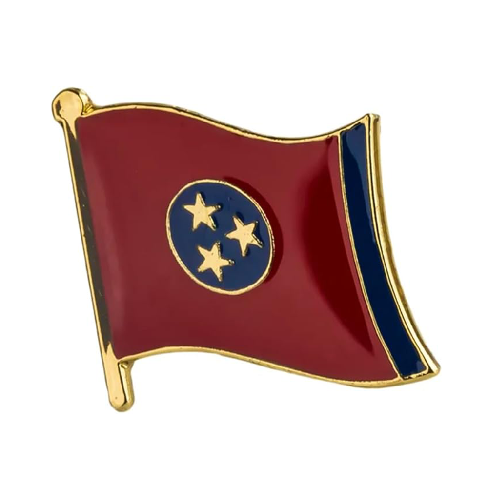 A red, white, and blue enamel pin badge shaped like the Tennessee flag with a brass plated iron butterfly clutch.