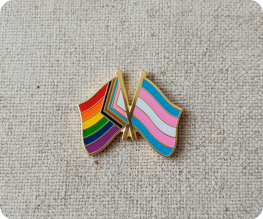 Insignia de orgullo y amistad transgénero con arcoíris