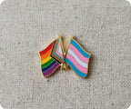 Insignia de orgullo y amistad transgénero con arcoíris