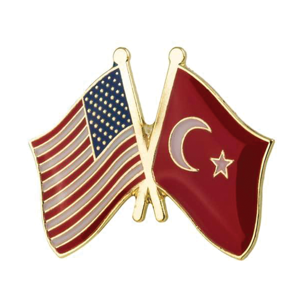 A friendship pin badge featuring the American flag and the Turkish flag on a red background with a butterfly clutch. © Tigoli® 2026 All Rights Reserved Panda Loco Ltd 