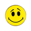 A round pin badge with a vibrant yellow background featuring a playful smily face design with black eyes and a curved mouth.