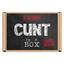 The image displays the packaging of the "Cunt In a Box" product, which is humorously designed to look like a box with a warning label that says "CAUTION: CUNT IN A 100% REAL BOX." The box is brown with a chalkboard-like texture, and the label adds a playful, risquu00e9 touch to the presentation. © Tigoli® 2026 All Rights Reserved Panda Loco Ltd 