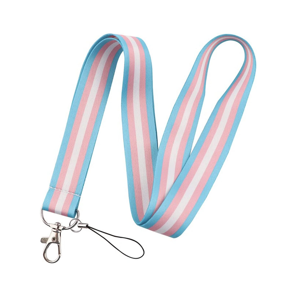 A lanyard with a transgender flag color scheme, designed to secure ID or keys, and featuring a clip at the bottom. © Tigoli® 2026 All Rights Reserved Panda Loco Ltd  Imagen principal del producto