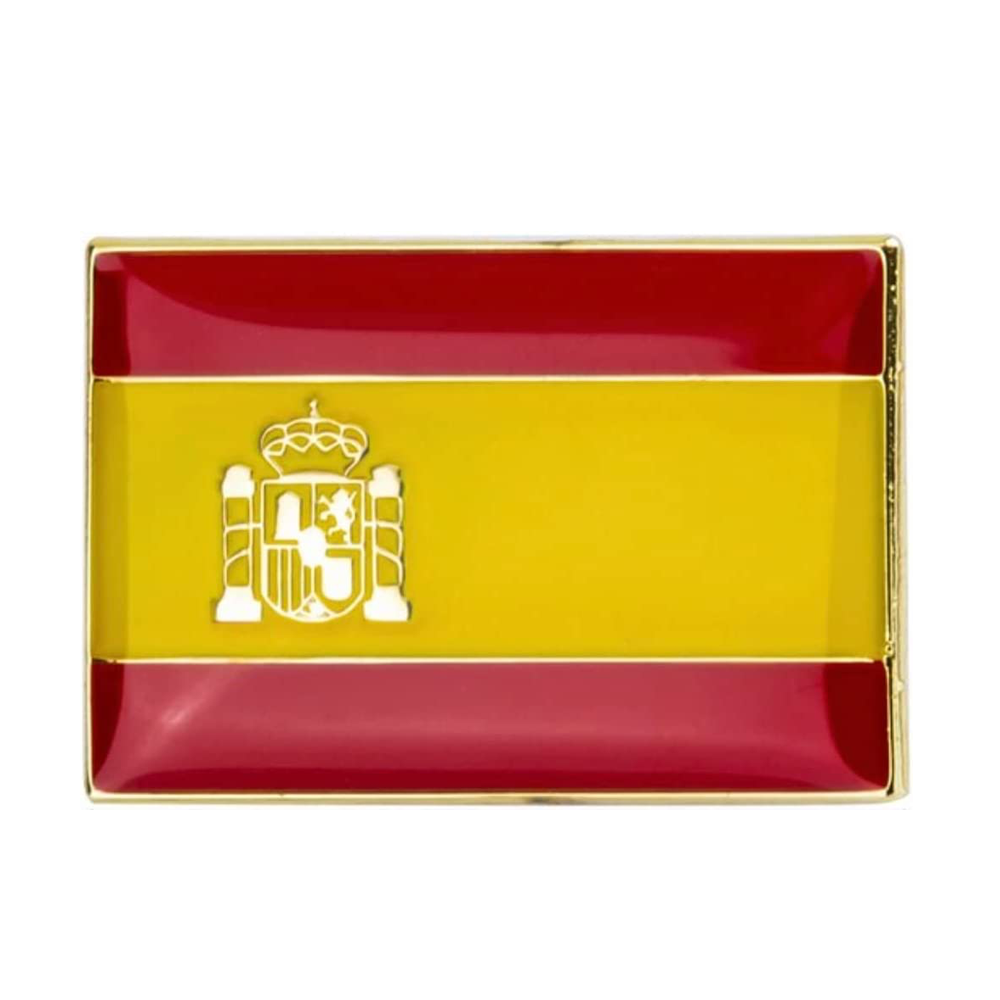 A rectangular enamel pin badge featuring the colors of the Spanish flag with a national emblem in the center, set against a yellow background. © Tigoli® 2026 All Rights Reserved Panda Loco Ltd  Main image