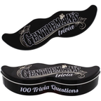 A black moustache-shaped tin gift with 'Gentleman's Trivia' text and 100 trivia questions printed on it, designed as a humorous stocking filler or party game. © Tigoli® 2026 All Rights Reserved Panda Loco Ltd 