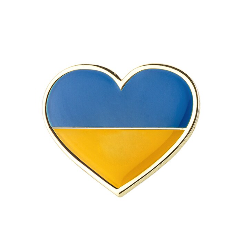 A pin badge featuring the Ukrainian flag colors in a heart shape with a brass plated iron base and a butterfly clutch. © Tigoli® 2026 All Rights Reserved Panda Loco Ltd 